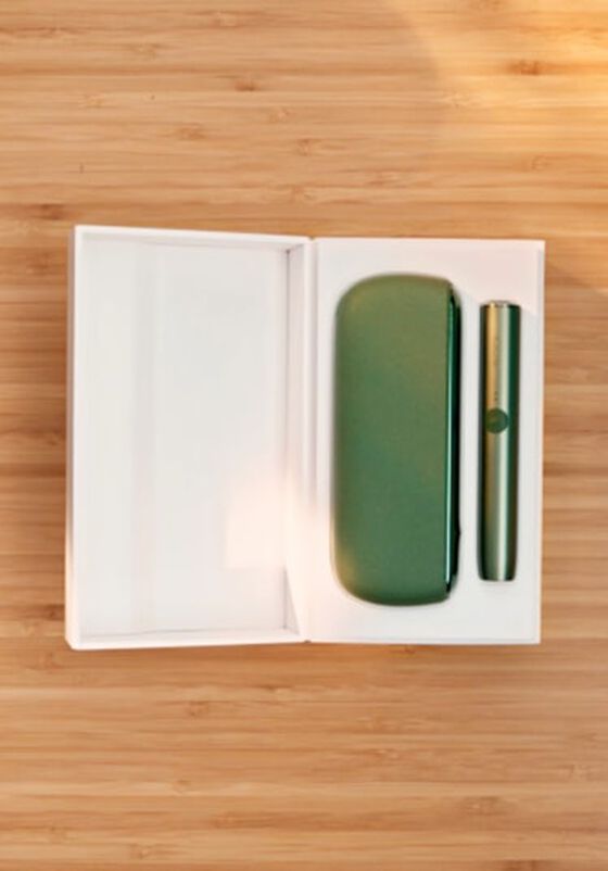 A Moss Green IQOS ILUMA holder and Pocket Charger in a box.