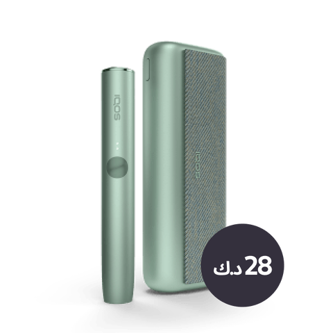 A jade green IQOS ILUMA PRIME device and holder.