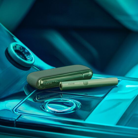 Gold IQOS DUO on a laptop