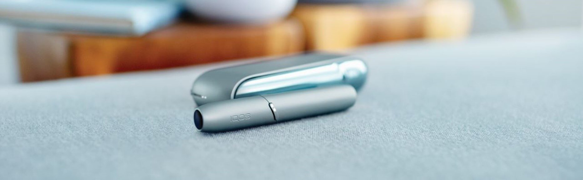 A light blue IQOS